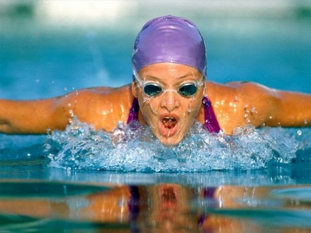 456456female taking breath during butterfly swim